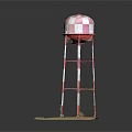Industrial Water Tower With Red And White Checkered Top And Metal Support Structure