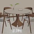 Round Wooden Dining Table With Four Chairs Featuring Light Colored Seats And Small Plant on Top