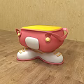 Pink And Yellow Children's Chair With Shoe Shaped Base And Decorative Buttons