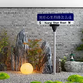 Garden Decor With Stone Wall Rock Formations Green Plants And Glowing Lamp