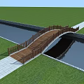 Wooden Bridge with Railing Connecting Green Lawn and Water Channel via Stone Path