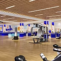 Modern Fitness Gym Interior With Blue White Decor Workout Equipment And Rest Area