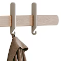 Cozy Brown Winter Clothing With Long Coat And Knitted Sweater Hanging On Hooks