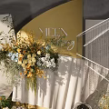 Elegant Banquet Hall With Geometric Backdrops Floral Decorations Silver Spherical Ornaments And NILIN 2024 Signage