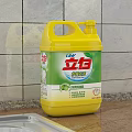 Liby Laundry Detergent Yellow Bottle on Kitchen Countertop with Tiled Wall