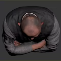 Man Standing with Arms Crossed in Black Vest Gray Shirt Brown Pants Gray Gradient Background