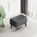 Orange And Yellow Ottoman Stools With Black Legs On Carpet Near Slippers And Green Plant