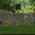 Beautiful Garden Yard With White Picket Fence Lush Green Lawn And Colorful Flowers