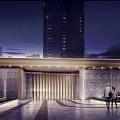 Modern Entrance Gate With Illuminated Lights Stone Wall And Moonlit Sky Near Tall Buildings