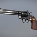 Close Up View Of Classic Revolver With Brown Grip And Metal Barrel
