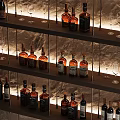 Elegant Modern Wine Cabinet With Wooden Shelves Stone Counter Illuminated Wine Bottles And Glasses