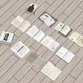 Multiple Open Books of Various Types Scattered On Light Colored Wooden Floor