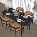Modern Black Dining Table Set with Orange Chairs Dinnerware Candles and Green Floral Arrangement