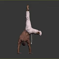 Man shirtless performing handstand in white pants with legs extended upward