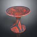 Intricate Circular Base Sculpture Carving With Red Black Geometric Abstract Patterns