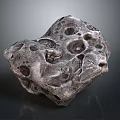 Natural Rough Stone With Irregular Holes And Grayish Brown Surface Texture