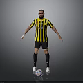 Man in Yellow and Black Striped Jersey Standing with Soccer Ball on Gray Background