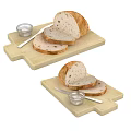 Fresh Sliced Bread on Wooden Cutting Board with Knife and Small Dish