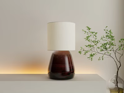 Modern Table Lamp with White Lampshade and Dark Base on Light Tabletop with Green Plant 3d model