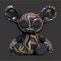 Iridescent Alien Toy Figure With Large Eyes Big Ears And Colorful Glossy Surface