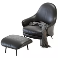 Luxurious Black Leather Accent Chair With Matching Ottoman And Wool Blanket
