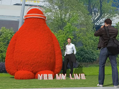 Giant Red Plant Shaped Garden Ornament with People Taking Photos in Outdoor Park 3d model