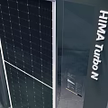 Exhibition Space With Central Clock Installation Surrounded By Cabinets And Reflective Floor