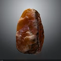 Natural Wood Stone With Red Pink Hue Irregular Shape And Glossy Texture Surface