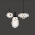 Modern Glass Pendant Lights with Various Shapes and Black Bases Featuring Warm Lit Bulbs