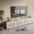 Modern White TV Stand In Living Room With TV Decorations And Green Plants