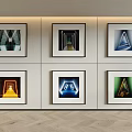 Six Framed Artworks With Geometric Shapes On White Wall And Herringbone Floor