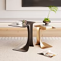 Modern Black And Gold Metal Side Tables With Potted Plant And Magazine On Carpet