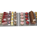 Colorful Assorted Desserts Displayed on Platters with Different Flavors and Name Tags