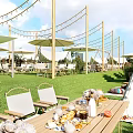Garden Landscape With Green Lawn White Chairs Sunshades Decorative String Lights And Outdoor Dining Table