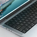 Silver Apple Laptops One Open with Screen Showing Landscape Icons and One Closed with Logo