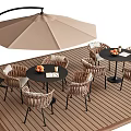 Outdoor Table Dining Set With Rattan Chairs And Beige Umbrella On Wooden Deck