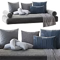 Stylish Gray and Blue Plush Pillows on Comfortable Sofa with Throw Blanket