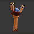 Colorful Handheld Slingshot With Orange Y Frame Black Elastic Bands Blue Projectile And Red Grip