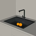 Modern Kitchen Black Washing Sink with Running Water Faucet and Oranges on White Countertop