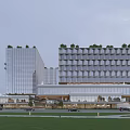Modern High Rise Hotel Building With Glass Facade Green Roof And Exterior Cars