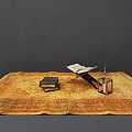 Traditional Books And Open Manuscript On Golden Patterned Carpet With Lantern