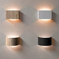 Square Round Shaped Wall Lamps with White Black Brown Wood Tones Illuminated on Gray Wall