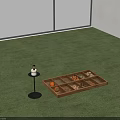 Green Carpet Floor With Candle Holder And Wooden Tray Containing Small Items