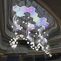 Colorful Transparent Geometric Art Installation Suspended From Modern Building Ceiling With Light Strings
