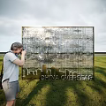 Golden Event Display Wall with China Overseas Text City Skyline Silhouette and Person Taking