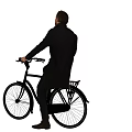 Man Riding Classic Black Bicycle Wearing Long Black Coat And Scarf
