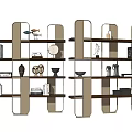 Modern Gold Metal Frame Shelving Unit With Black Shelves And Decorative Ornaments