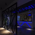 Modern Cyber Cafe Interior With Blue Lighting Black Metal Partition Computers Tables And Green Plants