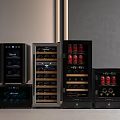 Sleek Black Refrigerators With Glass Doors Containing Wine Bottles And Canned Beverages