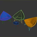 Vibrant Blue Gray Orange Single Chairs With Teardrop Shape And Metal Legs In Dark Background